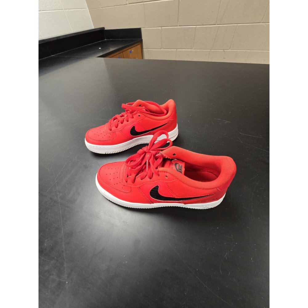 Nike Air Force 1 sneakers in the University Red, Black, and White